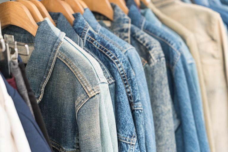 Clothes hang on a shelf
