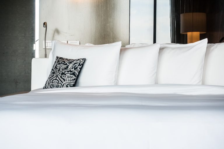 Beautiful pillow on bed decoration in bedroom interior