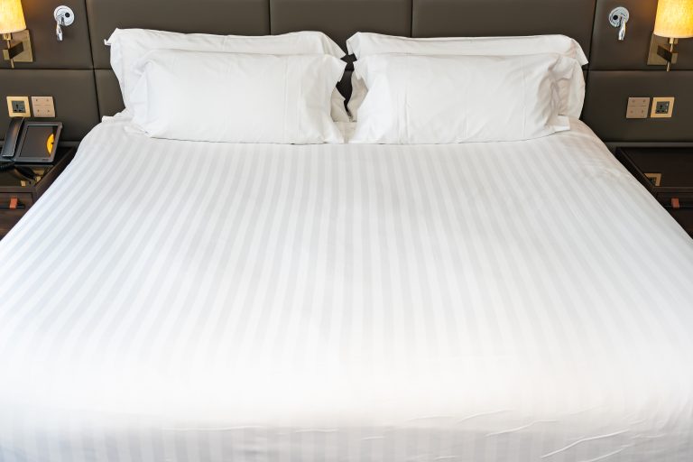 White pillow on bed decoration interior of bedroom